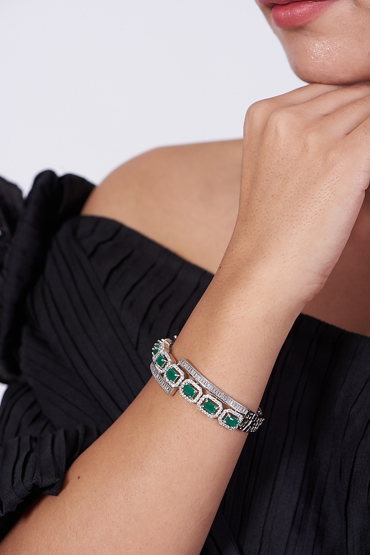 White Finish Bangle With Green Synthetic Stones by Aster at Pernia's Pop Up Shop