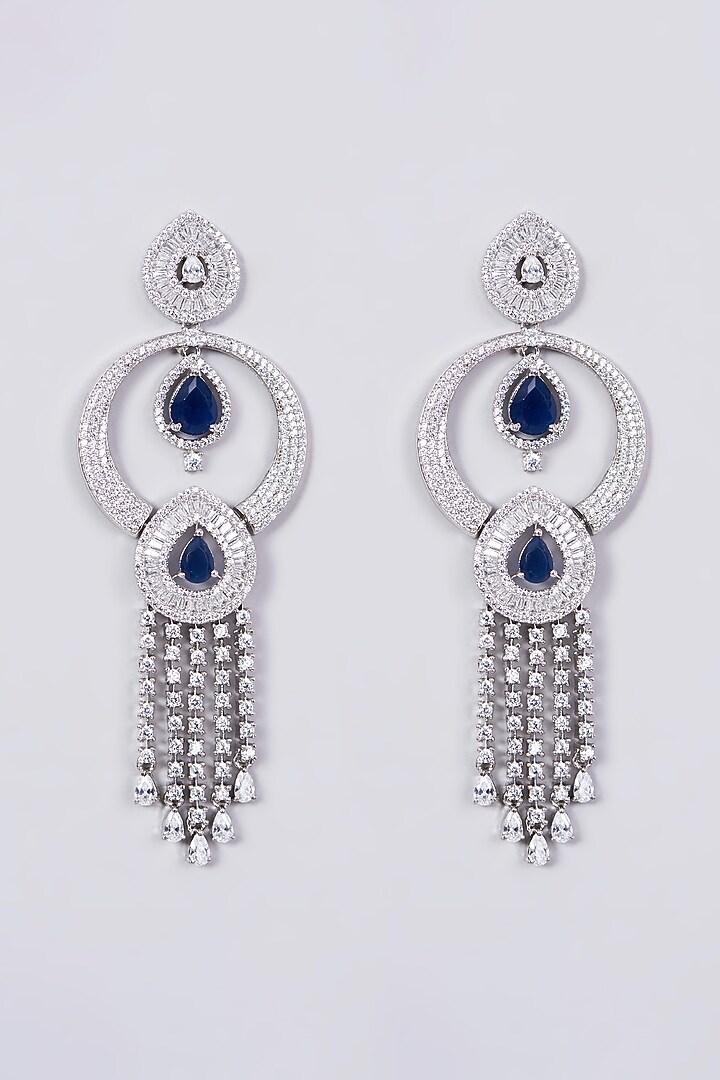 White Finish Dangler Earrings With Blue Stones by Aster at Pernia's Pop Up Shop