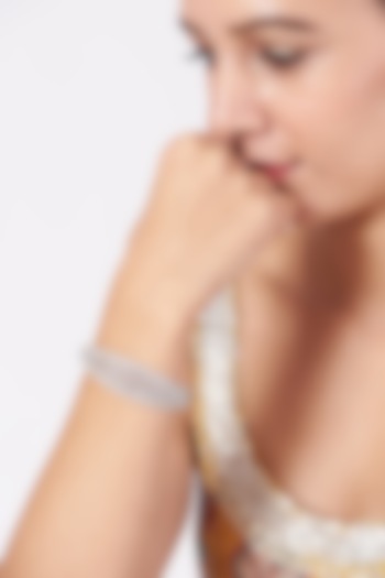 White Finish Faux Diamonds Bangle by Aster at Pernia's Pop Up Shop