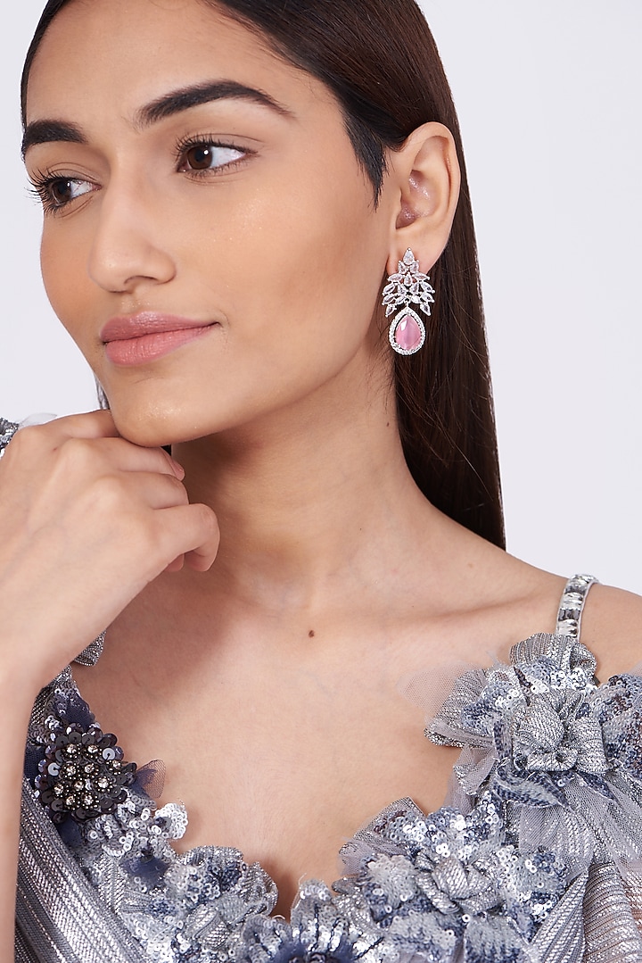 White Finish Earrings With Synthetic Stone by Aster at Pernia's Pop Up Shop