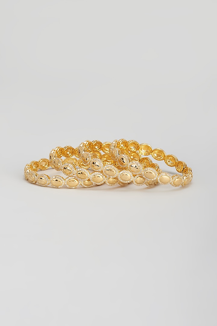 Gold Finish Zircon Bangles (Set of 4) by Aster at Pernia's Pop Up Shop