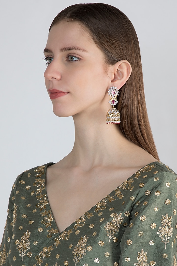 Gold Finish Jhumki Earrings With Dark Pink Stones by Aster at Pernia's Pop Up Shop