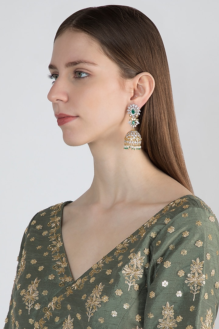 Gold Finish Jhumki Earrings With Green Stones by Aster at Pernia's Pop Up Shop