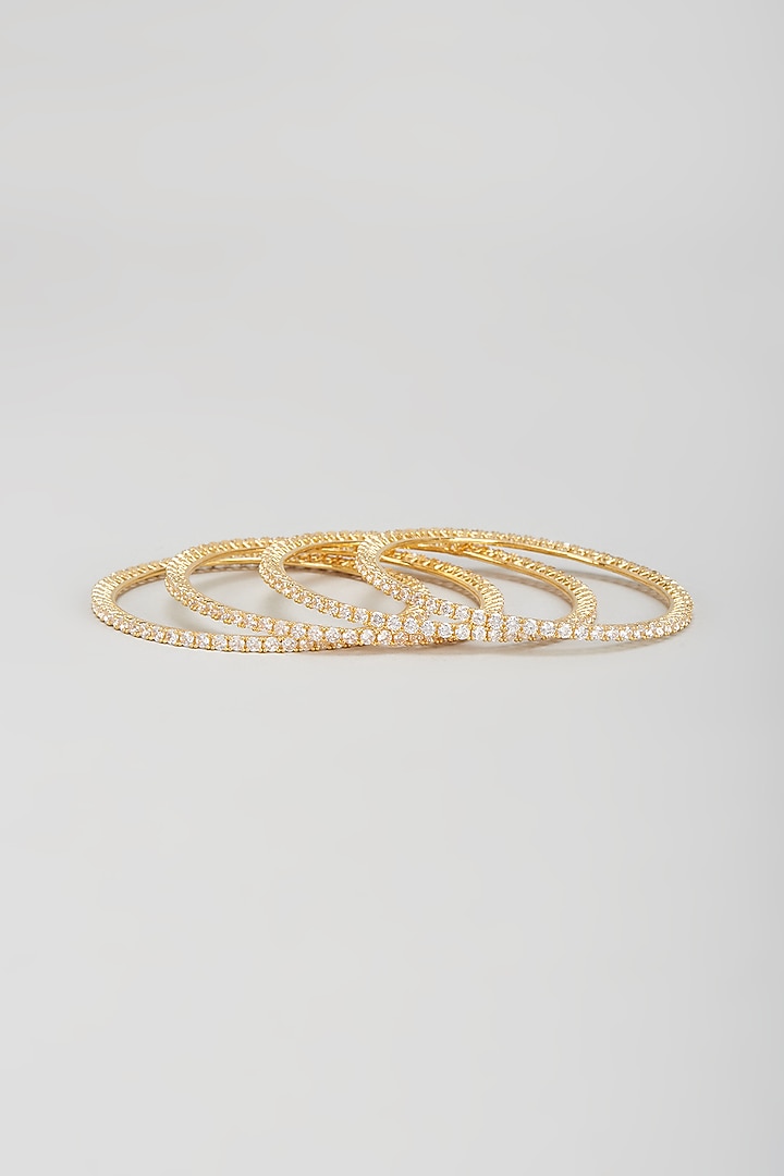 Gold Finish Zircon Bangles (Set of 4) by Aster at Pernia's Pop Up Shop