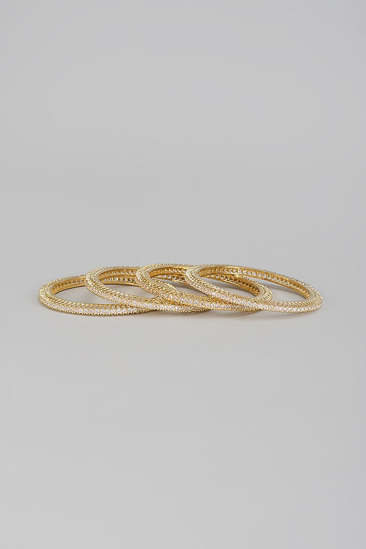Gold Finish Zircon Bangles (Set of 4) by Aster at Pernia's Pop Up Shop