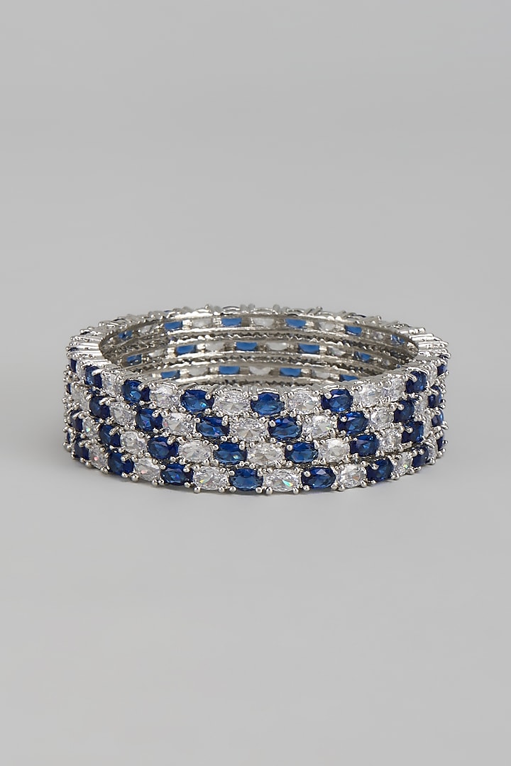 White Finish Zircon & Blue Stone Bangles (Set of 4) by Aster at Pernia's Pop Up Shop