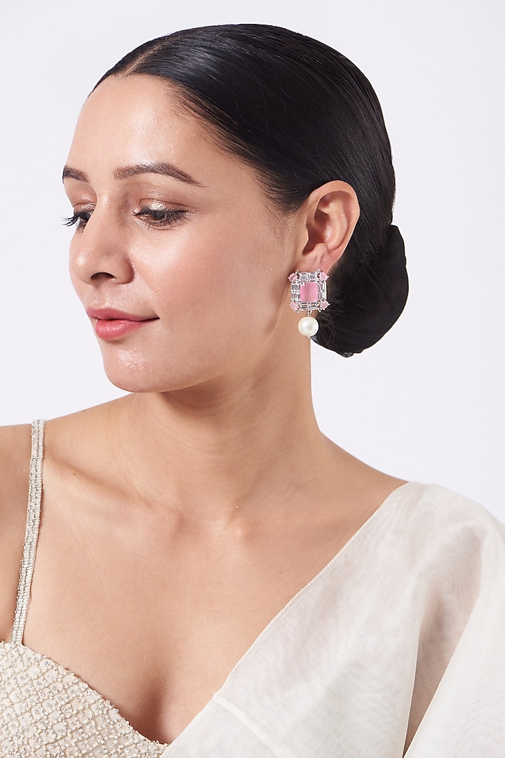 White Finish Stud Earrings With Pink Stones by Aster at Pernia's Pop Up Shop