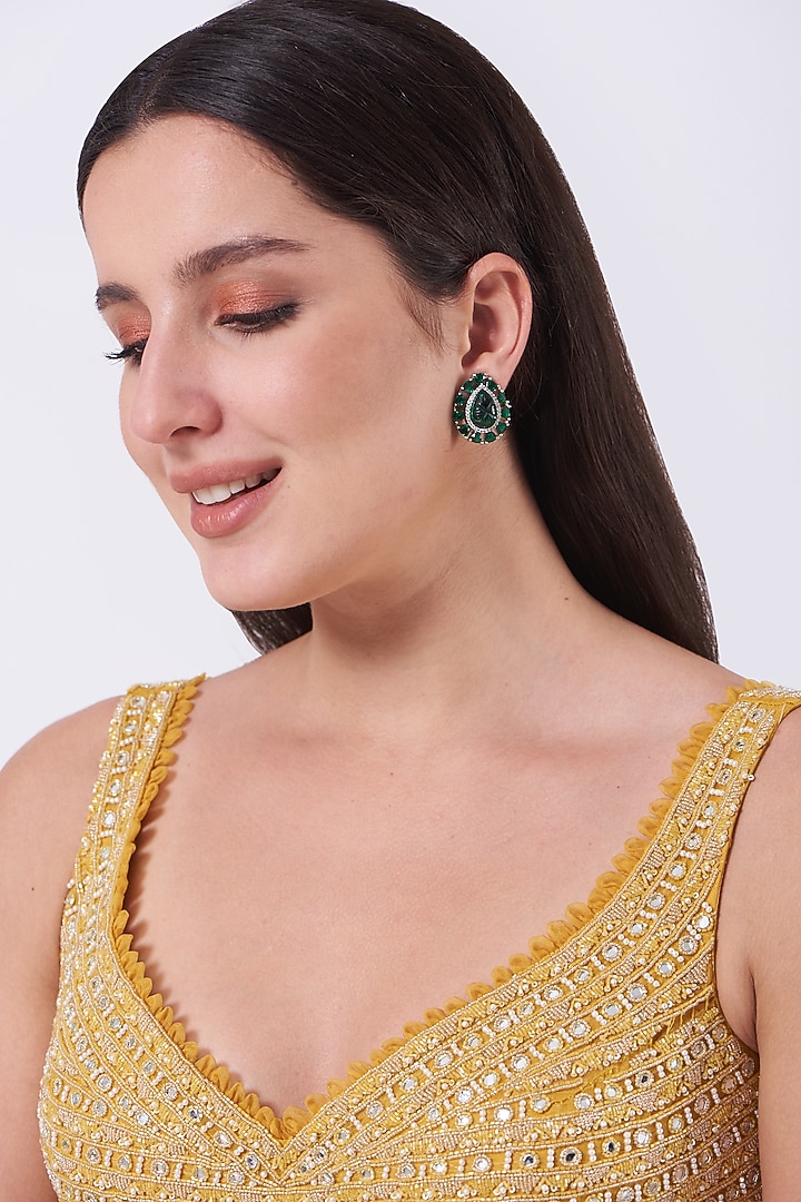 White Finish Stud Earrings With Green Stones by Aster at Pernia's Pop Up Shop
