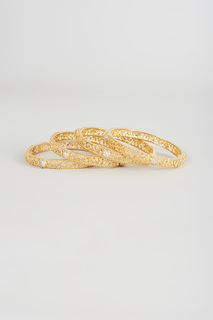Gold Finish Zircon Bangles (Set of 4) by Aster at Pernia's Pop Up Shop