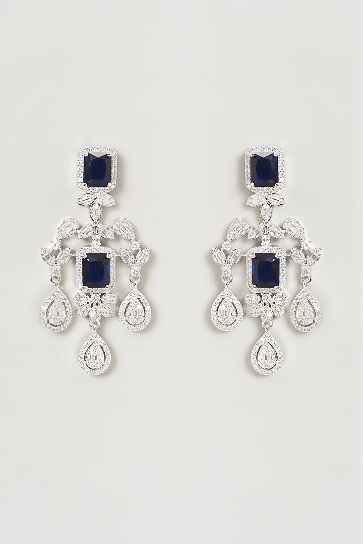 White Finish Faux Diamond & Blue Sapphire Dangler Earrings by Aster at Pernia's Pop Up Shop