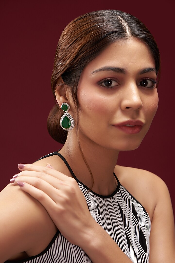 White Finish Faux Diamond & Emerald Dangler Earrings by Aster at Pernia's Pop Up Shop