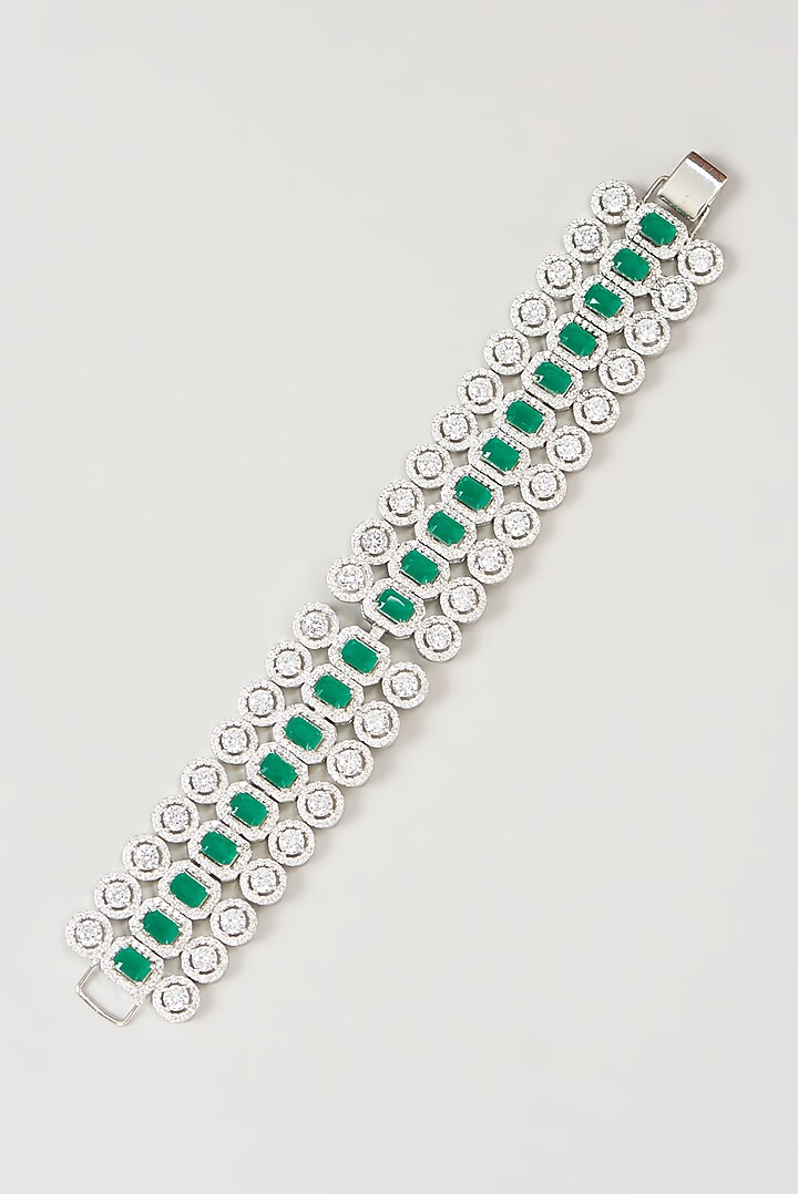 White Finish Faux Diamond & Emerald Bracelet by Aster at Pernia's Pop Up Shop