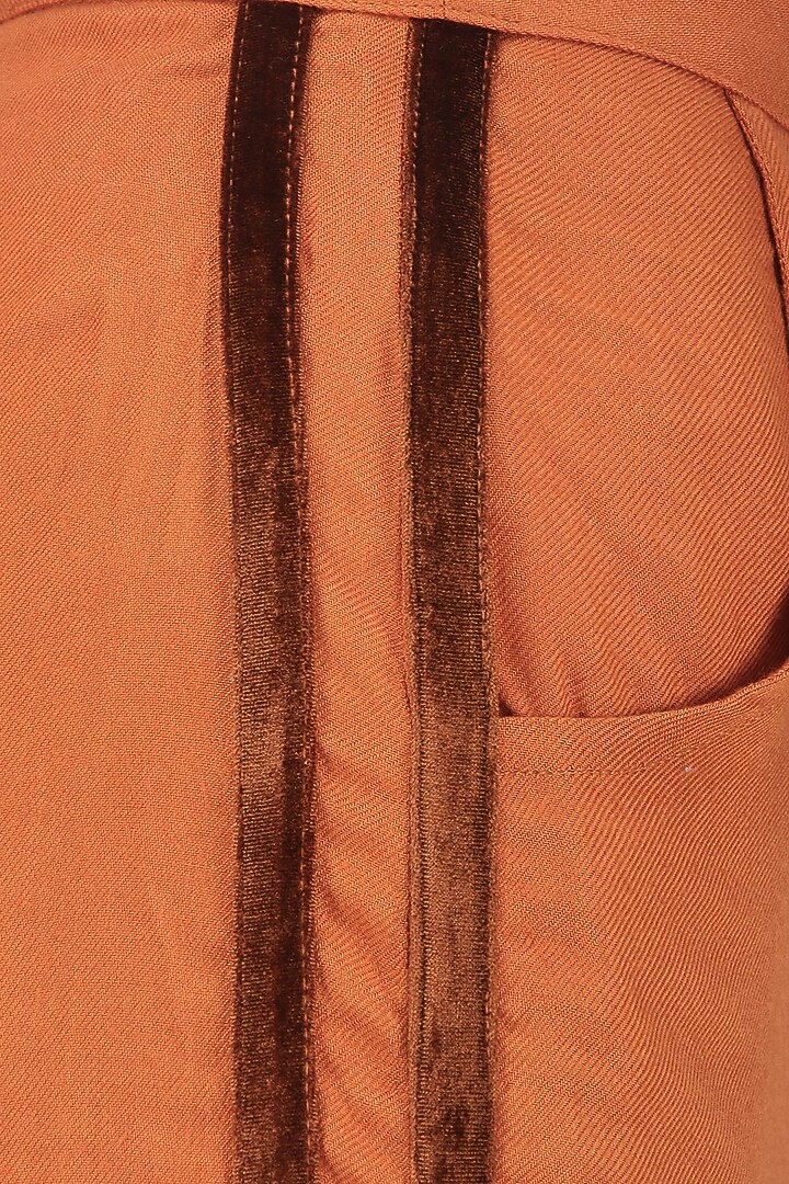 Dark orange striped trousers available only at Pernia's Pop Up Shop.