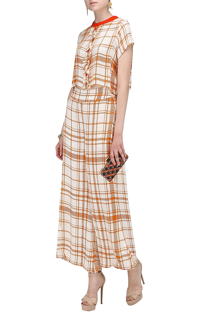 Orange and white striped wide leg trousers available only at Pernia's Pop Up Shop.