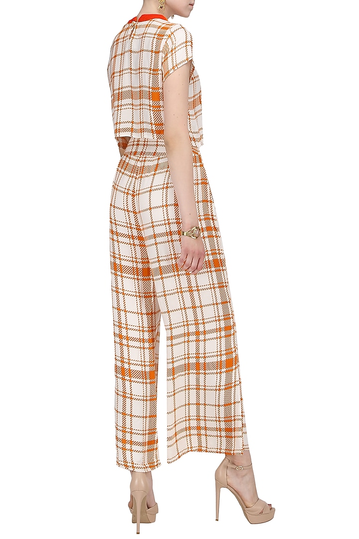 Orange and white striped wide leg trousers available only at Pernia's Pop Up Shop.