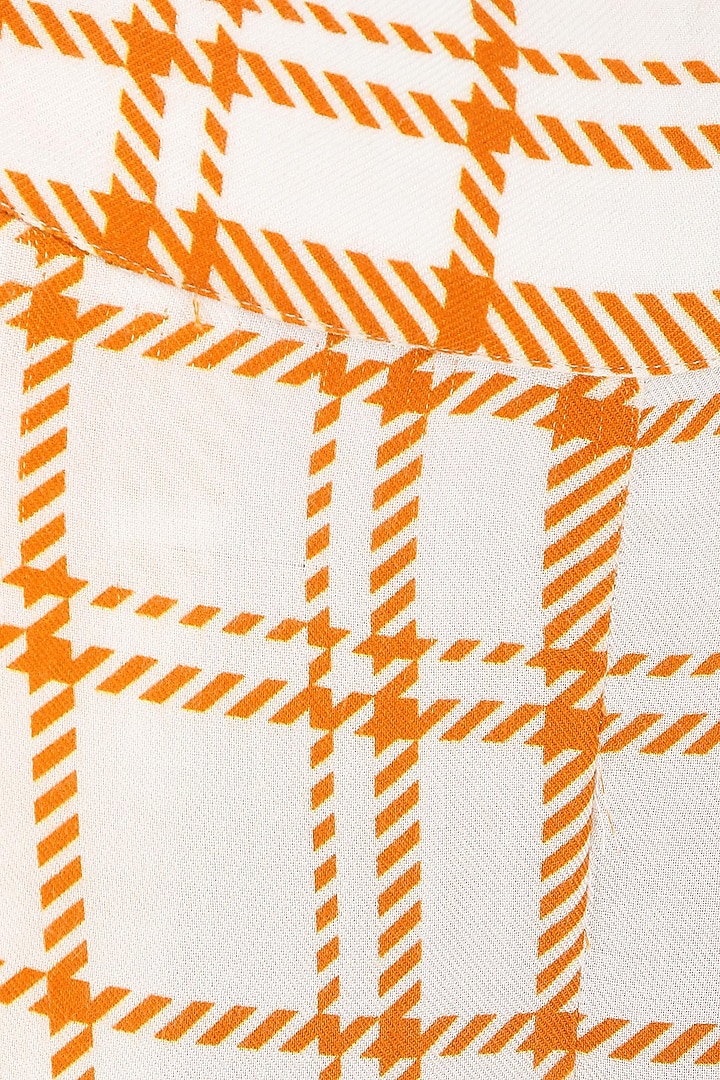 Orange and white striped wide leg trousers available only at Pernia's Pop Up Shop.