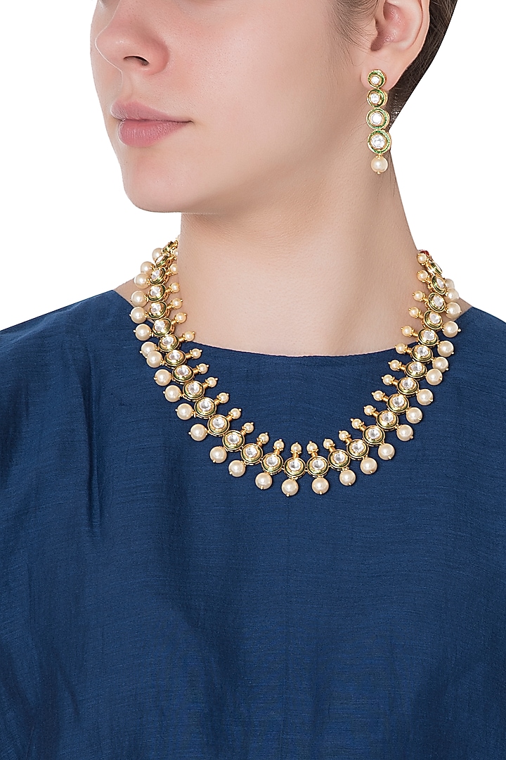 Gold finish kundan, pearls and green enamel choker necklace set available only at Pernia's Pop Up Shop.