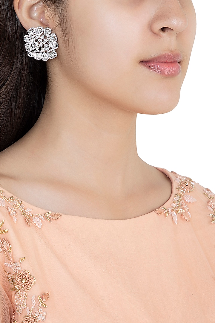 White Rhodium Plated Faux Diamond Stud Earrings by Aster at Pernia's Pop Up Shop