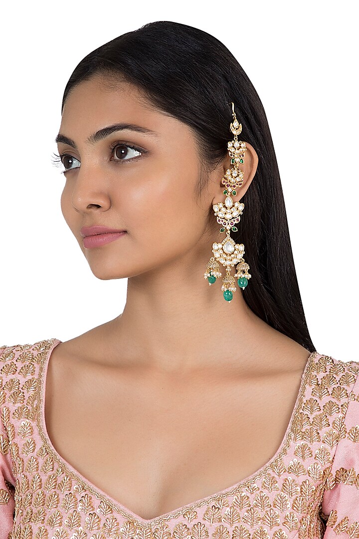 Gold plated faux kundan and green stone earrings by Aster