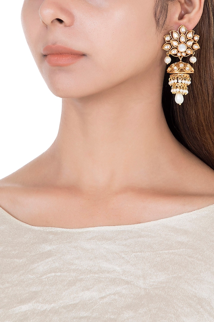 Gold plated faux kundan and white stone earrings by Aster