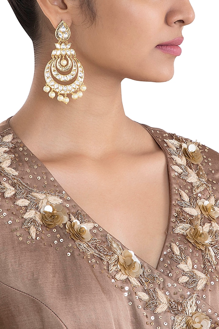 Gold plated faux kundan chandbali earrings by Aster