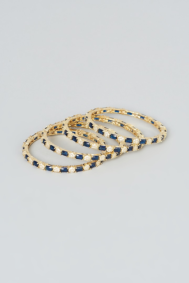 Gold Finish Blue Zircons Bangles (Set of 4) by Aster at Pernia's Pop Up Shop