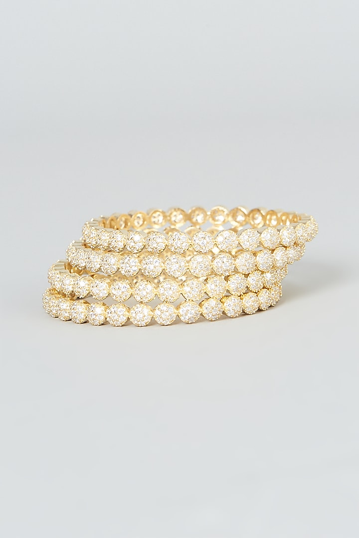 Gold Finish Zircon Bangles (Set of 4) by Aster at Pernia's Pop Up Shop