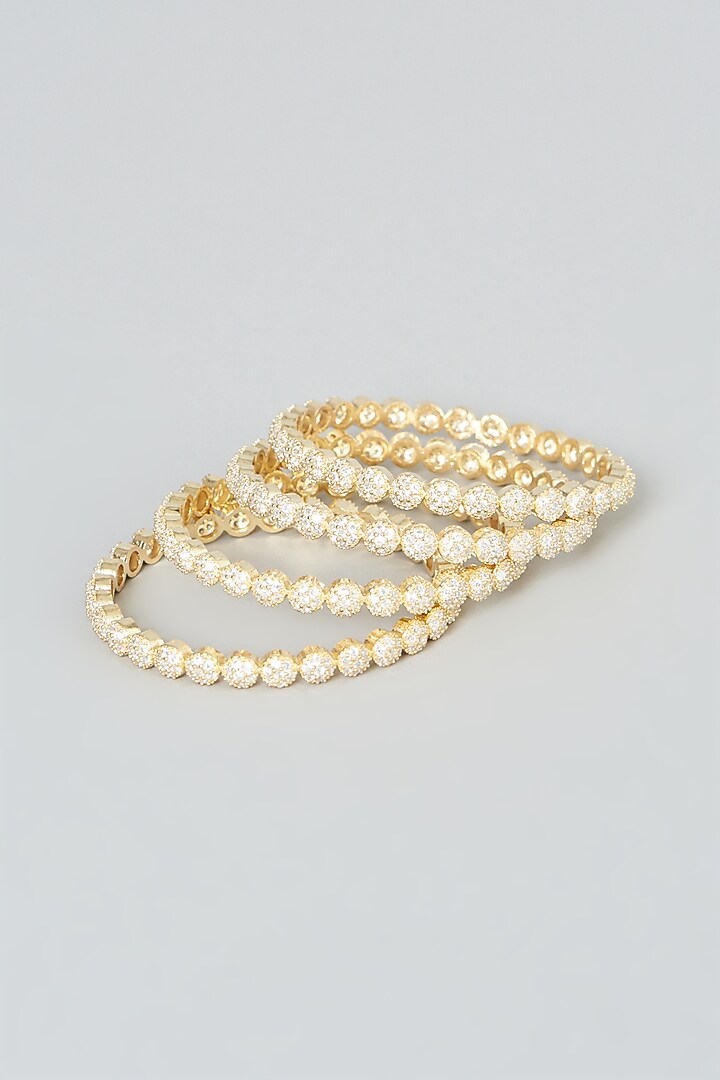 Gold Finish Zircon Bangles (Set of 4) by Aster at Pernia's Pop Up Shop