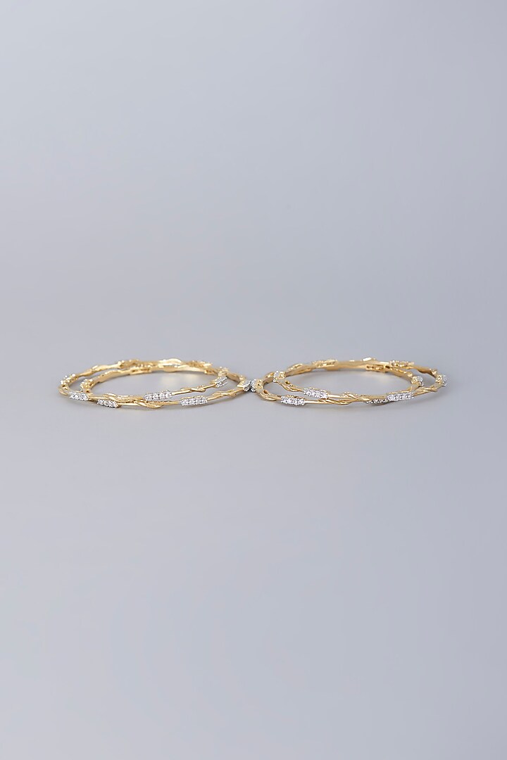 Gold Finish Zircon Bangles (Set of 4) by Aster at Pernia's Pop Up Shop