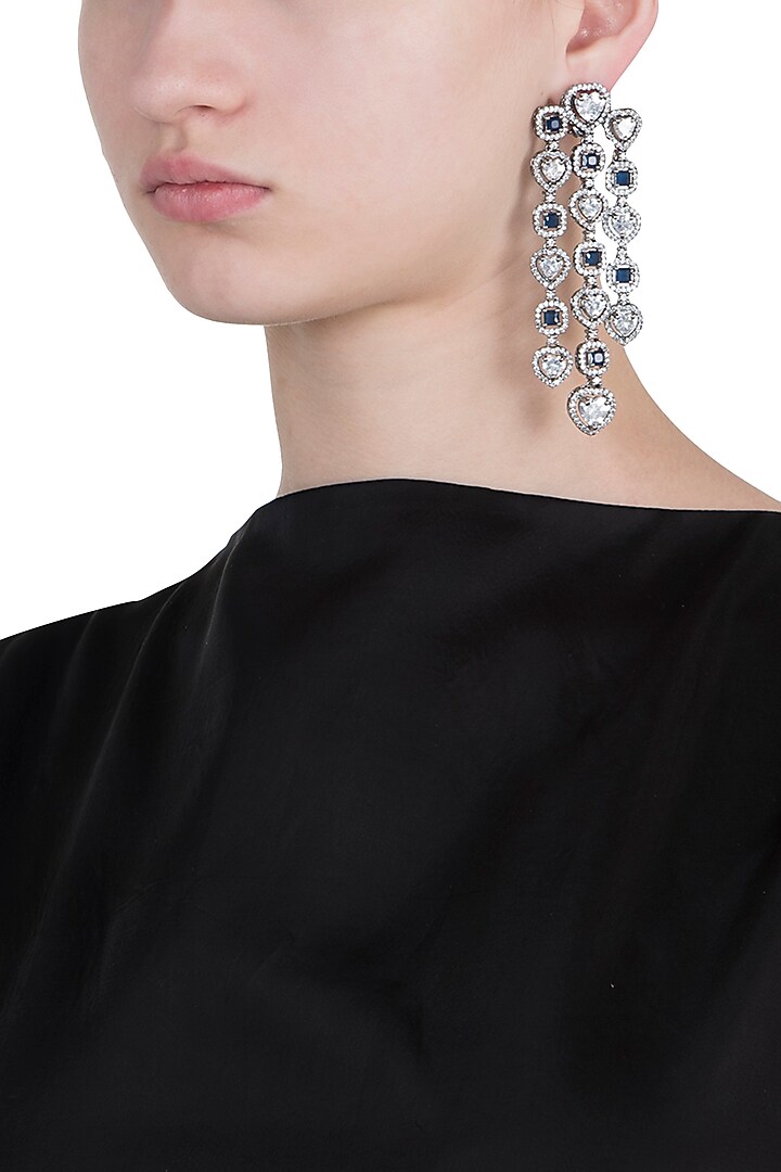 Rhodium plated faux diamond and sapphire dangler earrings available only at Pernia's Pop Up Shop.