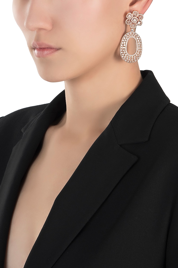 Rose gold faux diamond earrings by Aster