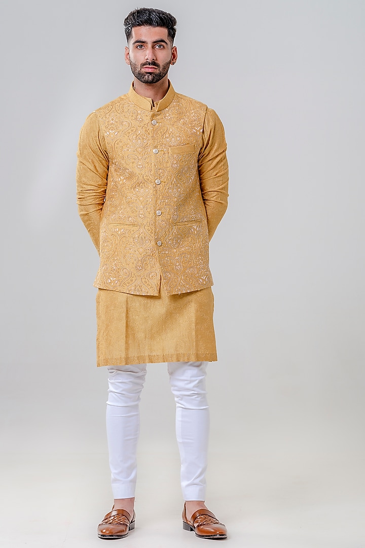 Mustard Lucknowi Embroidered Bundi Jacket With Kurta Set by Amrit Dawani