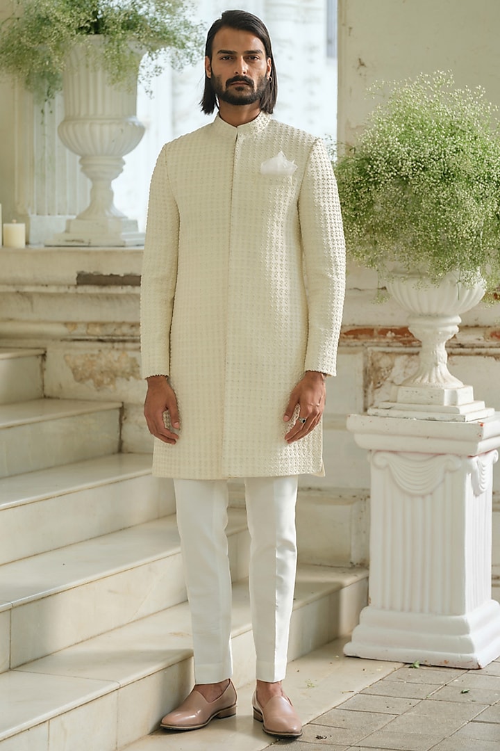 Ivory Silk Bead Hand Embroidered Sherwani Set by Amrit Dawani