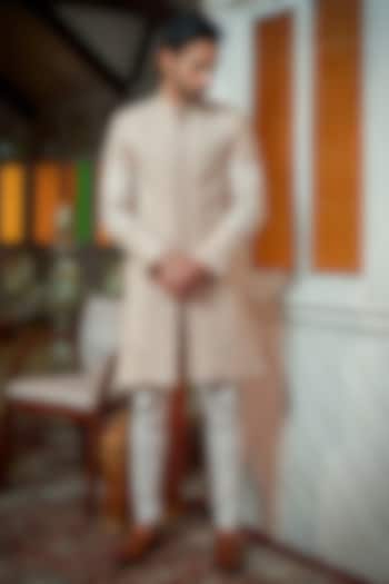 Rose Gold Raw Silk Motif & Beads Embroidered Groom Sherwani Set by Amrit Dawani at Pernia's Pop Up Shop