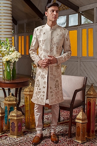Beige Gold Raw Silk Zari & Resham Embroidered Sherwani Set by Amrit Dawani