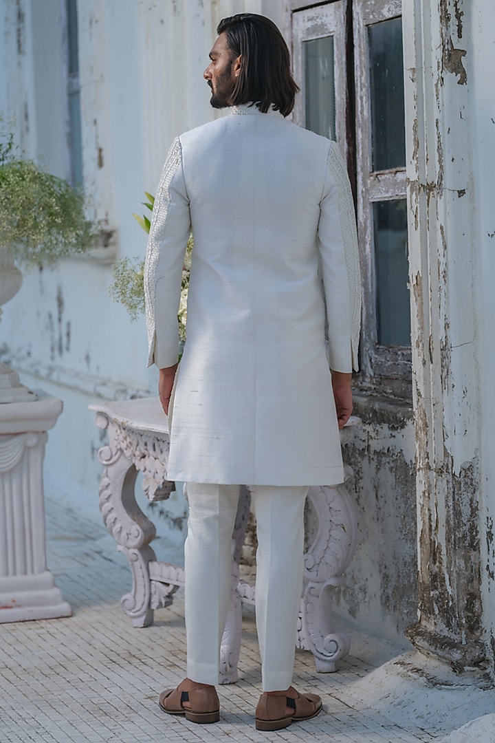 Ivory Raw Silk Floral Hand Embroidered Groom Sherwani Set by Amrit Dawani at Pernia's Pop Up Shop