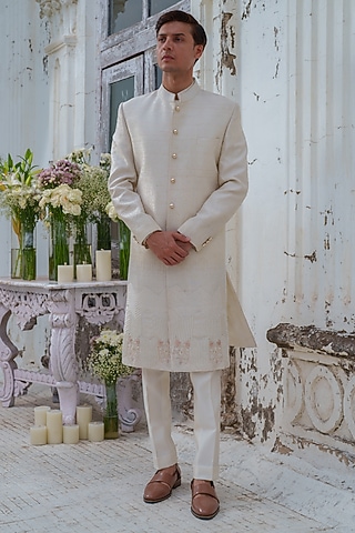 Ivory Raw Silk Floral embroidered Sherwani Set by Amrit Dawani