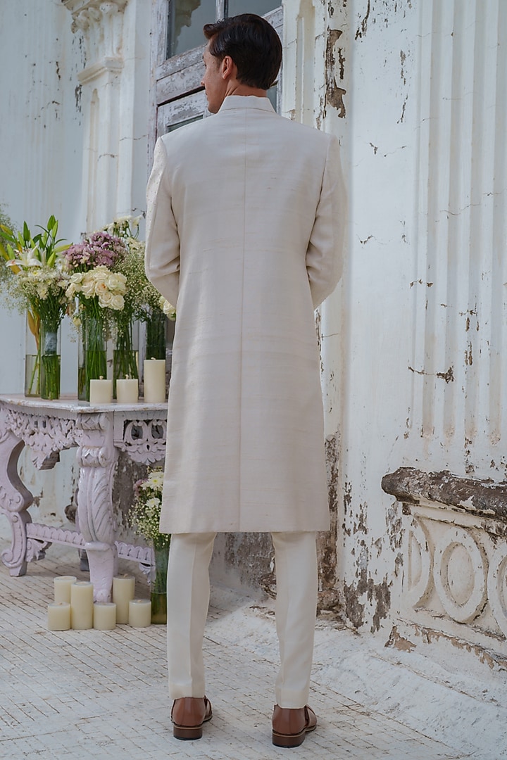 Ivory Raw Silk Floral embroidered Wedding Sherwani Set by Amrit Dawani at Pernia's Pop Up Shop