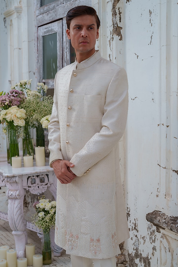 Ivory Raw Silk Floral embroidered Wedding Sherwani Set by Amrit Dawani at Pernia's Pop Up Shop