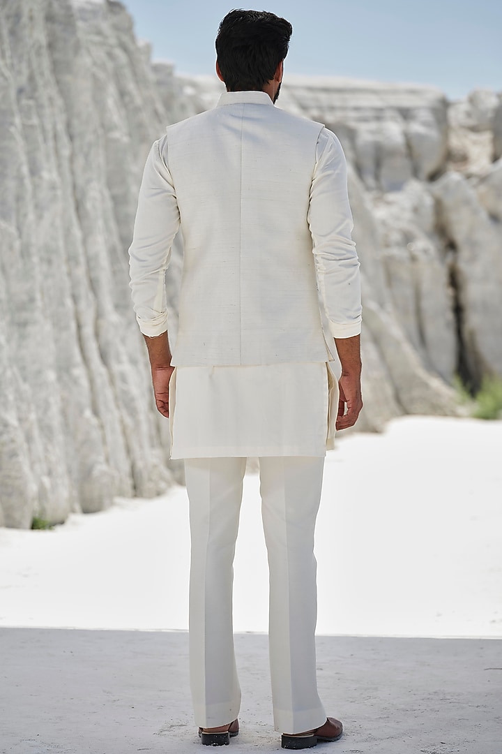 Ivory Raw Silk Thread Embroidered Bundi Jacket Set by Amrit Dawani at Pernia's Pop Up Shop