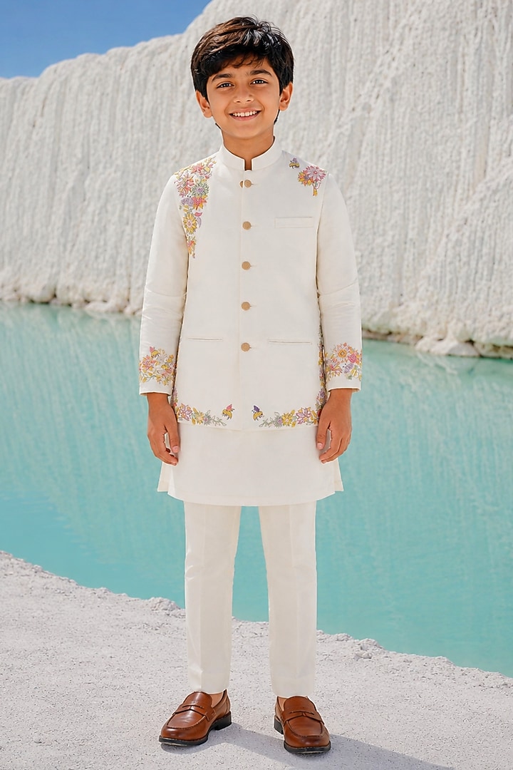 Ivory Modal Silk Floral Embroidered Bundi Jacket Set For Boys by Amrit Dawani Kids at Pernia's Pop Up Shop