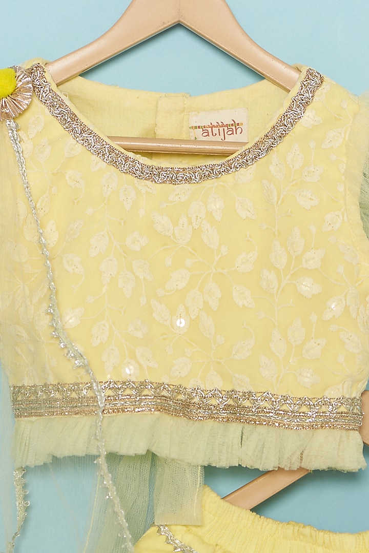 Yellow Net Layered Lehenga Set For Girls by ATIJAH at Pernia's Pop Up Shop