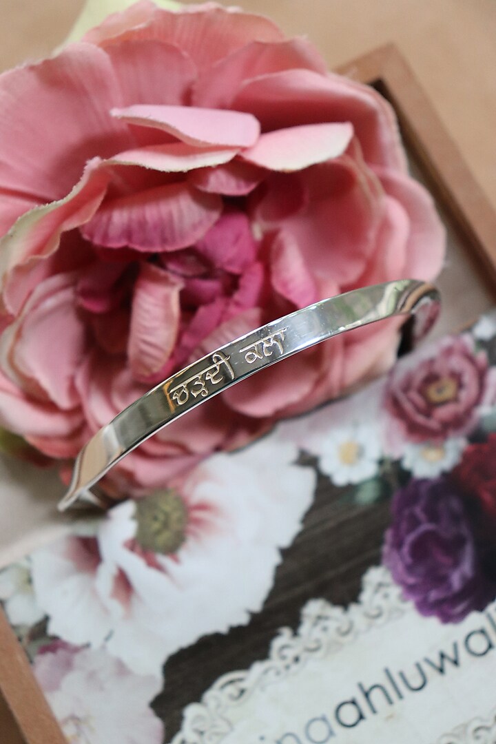 Silver Finish Nirbhau Nirvair & Chardi Kala Bangle In Sterling Silver by Eina Ahluwalia at Pernia's Pop Up Shop