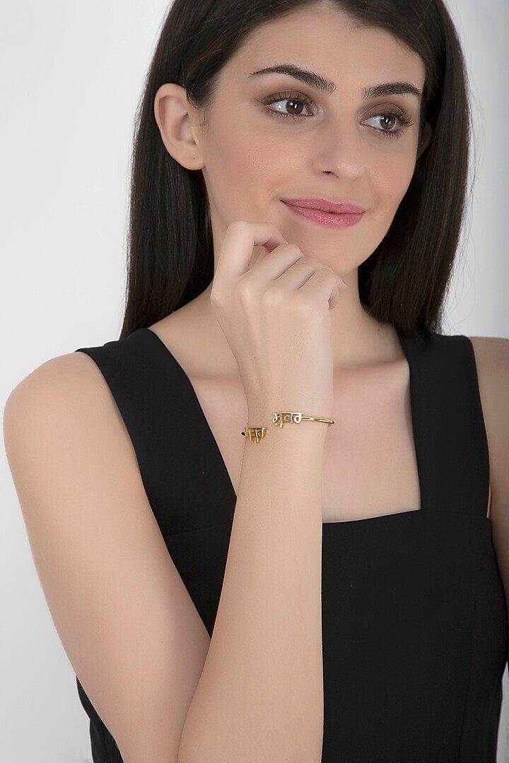 Gold Finish Bangle With Sabr & Shukr by Eina Ahluwalia at Pernia's Pop Up Shop