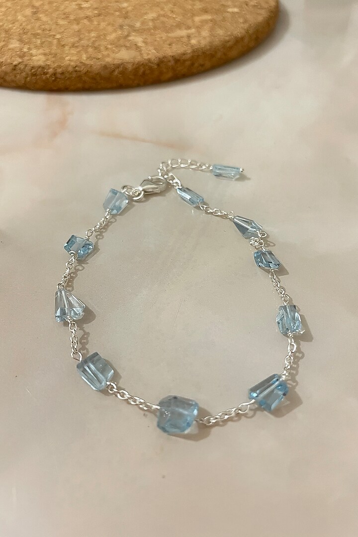 White Finish Blue Topaz Bracelet In Sterling Silver by Autumn Poppy at Pernia's Pop Up Shop