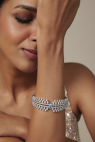 White Rhodium Finish Blue Sapphire Stone Bangle In Sterling Silver by Aurashni