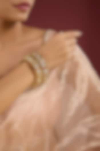 Gold Finish Kundan Polki & Pearl Bangles (Set Of 2) by Auraa Trends at Pernia's Pop Up Shop