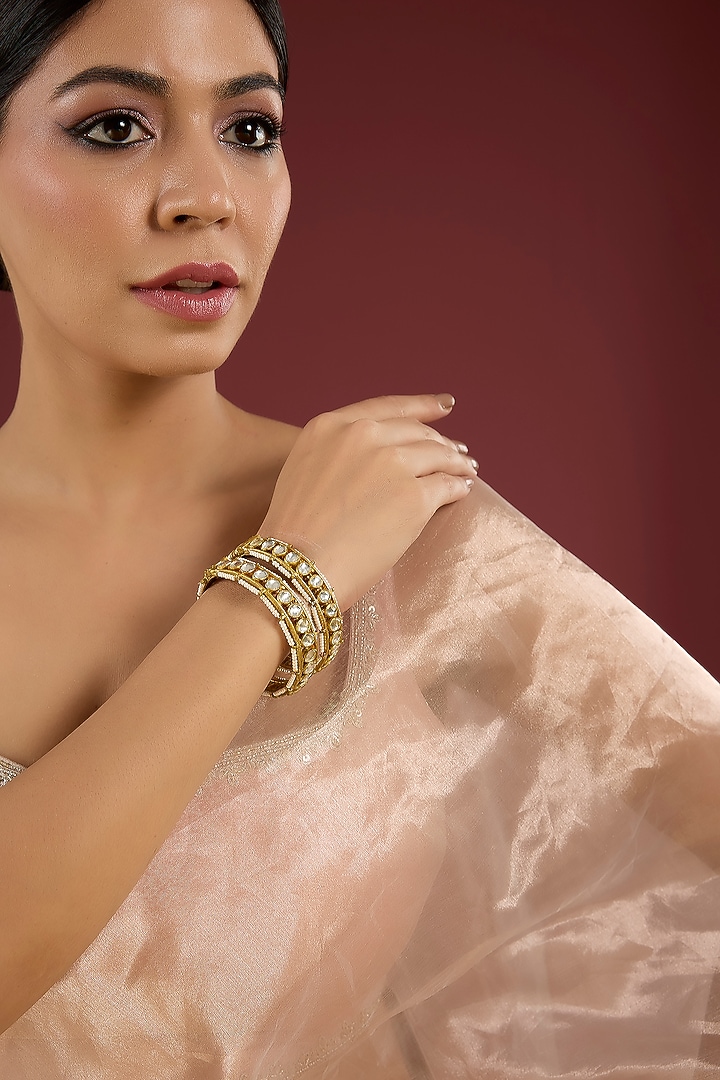 Gold Finish Kundan Polki Bangles (Set Of 2) by Aura Trends at Pernia's Pop Up Shop