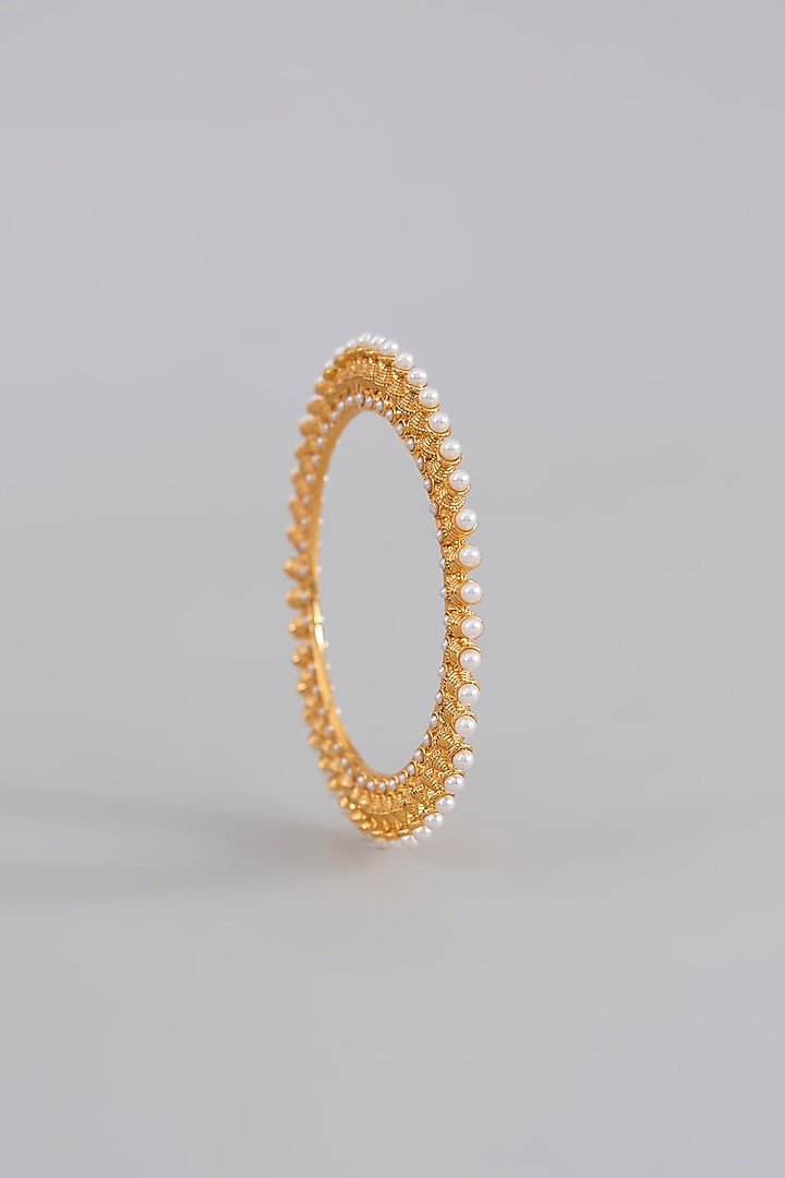 Gold Finish Pearl & Beaded Bangles (Set Of 2) by Aura Trends at Pernia's Pop Up Shop