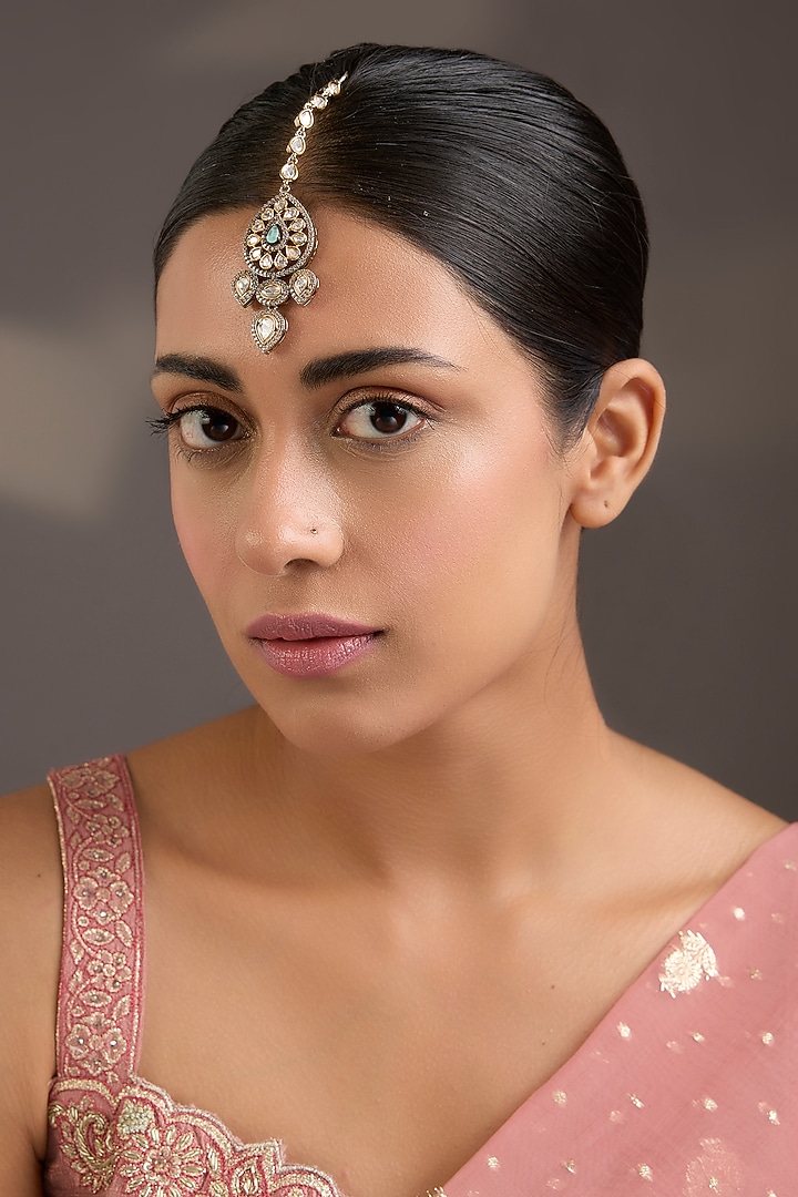 Antique Gold Finish Green Stone & American Diamond Floral Maangtikka by Aura Trends at Pernia's Pop Up Shop